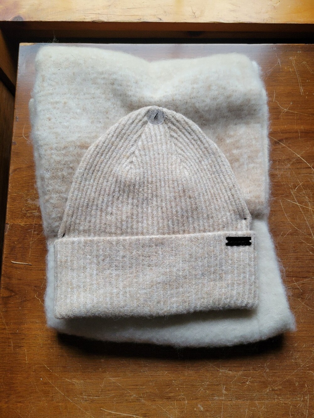 Nicole Miller Beige Ribbed Knit Beanie with Logo Plaque
